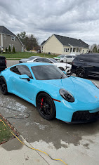 Blue sports car during an exterior detailing service