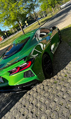 Green sports car with a glossy detailed exterior