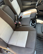 Clean vehicle seats and center console after interior detailing
